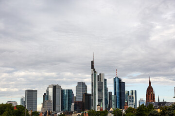 Obraz premium Cityscape with skyscrapers and cloudy sky