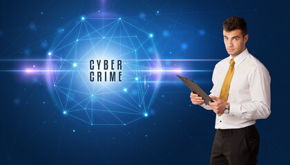 Businessman thinking about security solutions with CYBER CRIME inscription