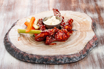Chicken legs in barbecue sauce with fresh vegetables and tartar sauce