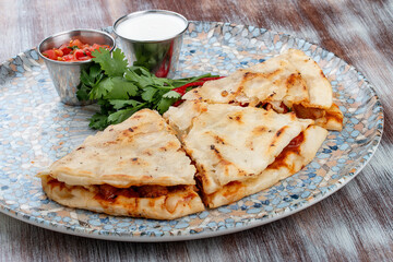 Quesadilla with сhicken, cheese and paprika. Traditional Mexican dish