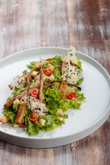 Salad with baked eggplant, mozzarella and romaine lettuce