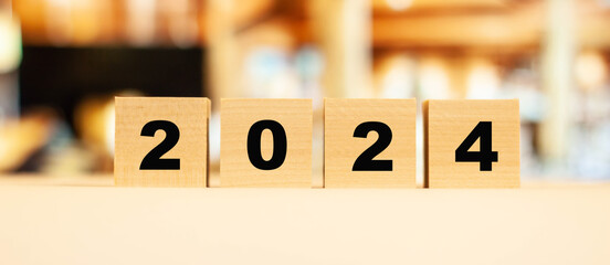 Date 2024 on wooden cubes. Numbers for home business.