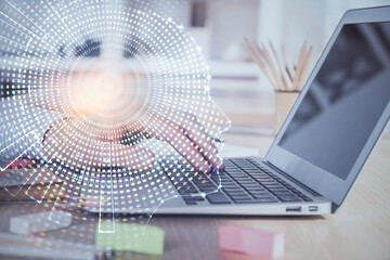 Man typing on keyboard background with brain hologram. Concept of big Data. Double exposure.