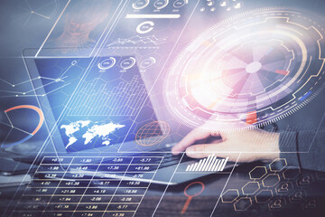 Fototapeta premium A man working on Laptop with technology theme drawing. Concept of big data. Double exposure.