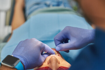 Professional cleaning with dental floss.