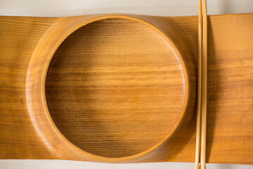 Wooden plate for sushi. Craft Japanese tableware. Exclusive handmade bowl with wood texture