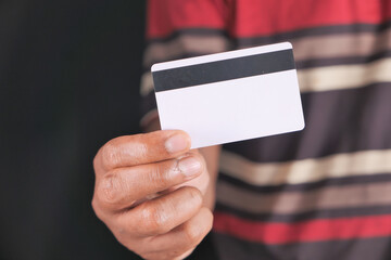  hand holding credit cards reading information 