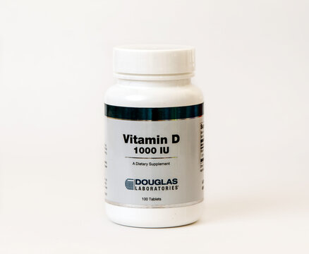 A Bottle Of Vitamin D Supplement Isolated On White.