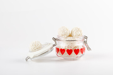 truffles white chocolate  covered with coconut flakes on white background