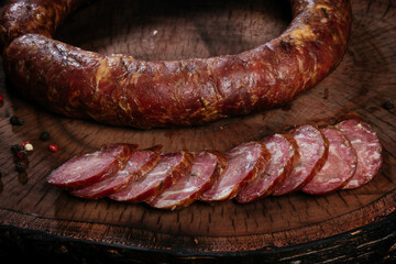 Homemade sausage, traditional cooking for the winter. Close up of sliced ​​staples. Salami with pieces of lard.