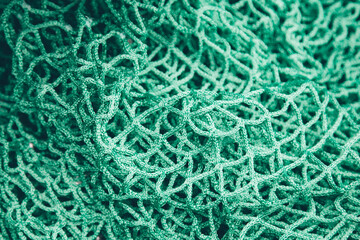 Close up of a commercial green fishing net 