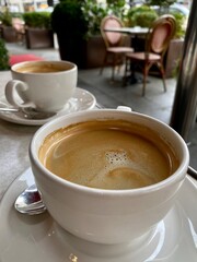 two white cups of cappuccino