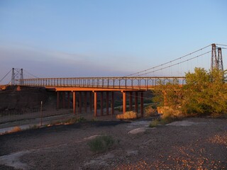 Fototapeta premium Wide shot of the historic Tanner's Crossing Bridge over Little Colorado River at Cameron, Arizona.