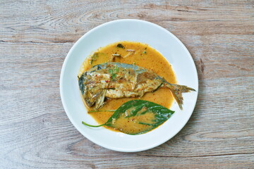 spicy boiled mackerel in red curry sauce on dish
