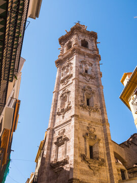 Beautiful baroque belfry bell tower of the Santa Catalina church in Valencia, Spain. Valencian gothic roman catholic architecture. Beautiful vertical photo.