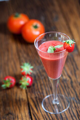 gazpacho with strawberry and tomato presented in a cocktail glass