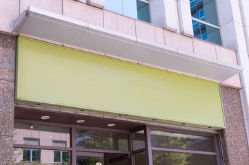 Large blank billboard on a street wall, banners with room to add your own text