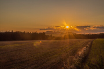 Big color meadows and forest with sunset sky near Utery town