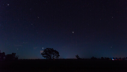 Naklejka premium Panorama blue night sky milky way and star on dark background.Universe filled with stars, nebula and galaxy with noise and grain.select white balance.selection focus.amazing.
