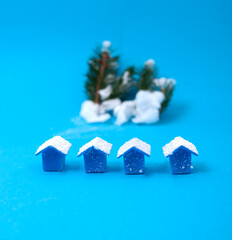 A small miniature houses in winter landscape