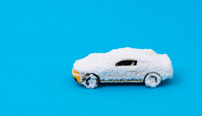 A car covered in snow. Miniature color play