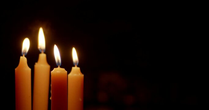 Candles are lit with a bright flame.