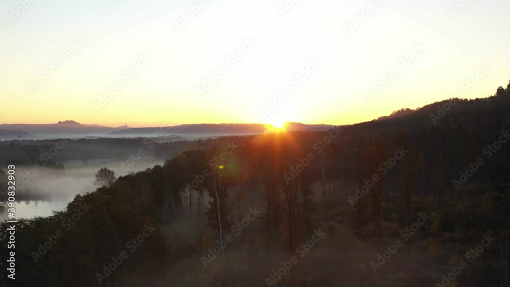 Wall mural Aerial footage of sunrise over beautiful middle Europe landscape with fog