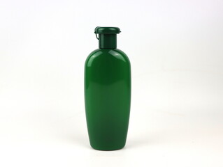 blank packaging green shampoo bottle isolated on white background