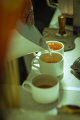 cup of tea and teapot in a coffee shop