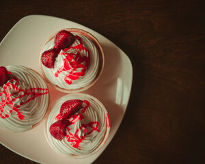 Cupcakes on wooden table close up in coffee shop ,