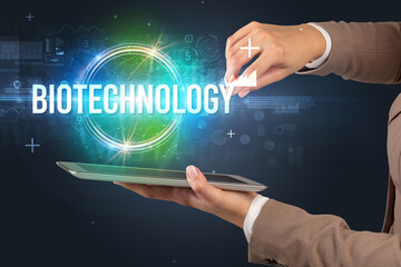 Close-up of a touchscreen with BIOTECHNOLOGY inscription, new technology concept
