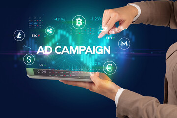 Close-up of a touchscreen with AD CAMPAIGN inscription, business opportunity concept