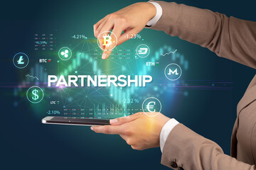 Close-up of a touchscreen with PARTNERSHIP inscription, business opportunity concept