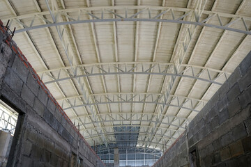 The roof of the building is coated with PU Foam. Construction site.