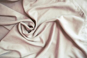 Beige velour pleats. Soft blackout curtains for the room. Fabric for tailoring.