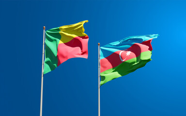 Beautiful national state flags of Azerbaijan and Benin together at the sky background. 3D artwork concept.