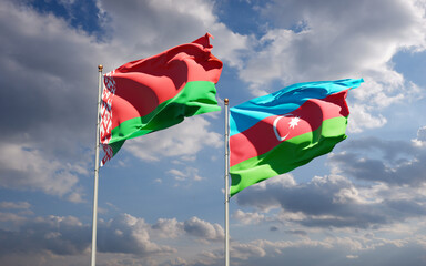 Beautiful national state flags of Azerbaijan and Belarus together at the sky background. 3D artwork concept.