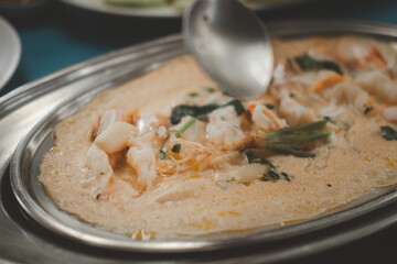 Steamed egg with shrimp and vegetables.