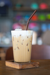 Glass of iced coffee cappuccino with straw