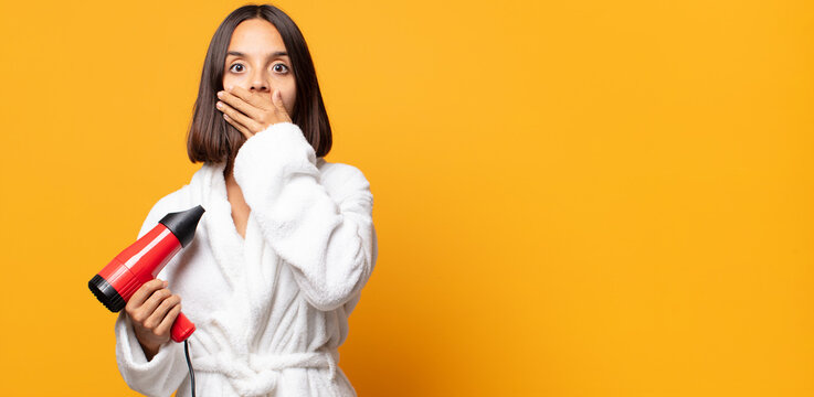 covering mouth with hands with a shocked, surprised expression, keeping a secret or saying oops