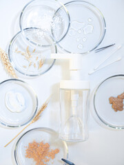 Serum for skin care, eco-friendly cosmetics. Bottles and ingredients