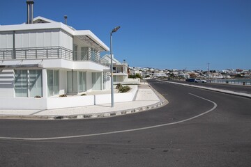 Bright white buildings in Yzerfontein. By the shore of the Atlantic Ocean, on the west coast of South Africa.
