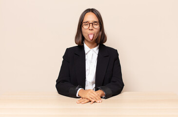 with cheerful, carefree, rebellious attitude, joking and sticking tongue out, having fun