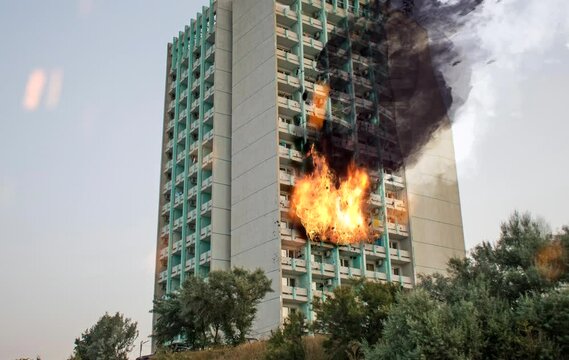 Fire on the upper floors of a tall hotel. Fire in a tall building.