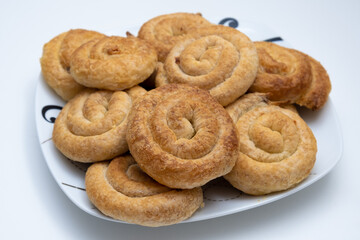 Sweet cinnamon rolls on a white plate