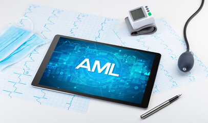 Close-up view of a tablet pc with AML abbreviation, medical concept