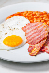 English breakfast with bacon beans and egg