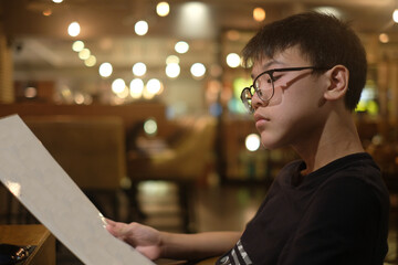 Asian boy with bokeh from the lights