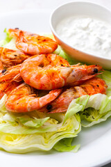 still lfe of grilled shrimps with garlic dip