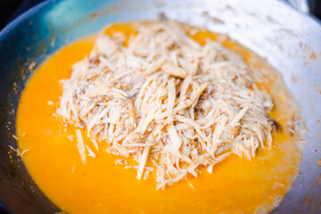 Traditional spicy curry soup of pickled bamboo shoot with chilly paste, basil and fried tofu in the pan.